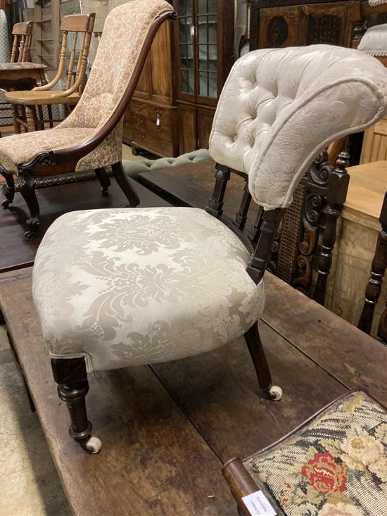 A pair of Victorian mahogany framed tapestry topped gout stools and a later Victorian button backed nursing chair